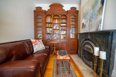 MacNamara House library with fireplace